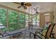 Inviting screened porch with stylish rug and comfortable seating, ideal for entertaining guests at 1311 Cobblemill Nw Way, Kennesaw, GA 30152