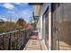 Wrought iron balcony overlooking a dense forest with a view of a bright blue sky at 2921 Lenox Rd # 308, Atlanta, GA 30324