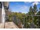Wrought iron balcony overlooking a dense forest at 2921 Lenox Rd # 308, Atlanta, GA 30324