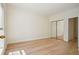 Bright bedroom with an adjacent mirrored closet and view into the hallway at 2921 Lenox Rd # 308, Atlanta, GA 30324