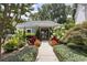 A charming clubhouse nestled among vibrant flowers and lush greenery, creating a welcoming community space at 2921 Lenox Rd # 308, Atlanta, GA 30324