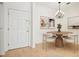 Dining area with stylish chandelier and view of the front door at 2921 Lenox Rd # 308, Atlanta, GA 30324