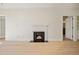 Open living area with hardwood floors and fireplace at 2921 Lenox Rd # 308, Atlanta, GA 30324
