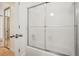 Bathroom area featuring a white shower tub with a frosted sliding glass door at 2921 Lenox Rd # 308, Atlanta, GA 30324