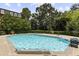 A sparkling swimming pool offers a refreshing retreat, surrounded by well-maintained landscaping and lounge chairs at 2921 Lenox Rd # 308, Atlanta, GA 30324