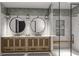 Modern bathroom with a dual vanity, round mirrors, and a glass-enclosed shower with a bench at 3629 Centerville Rosebud Rd, Snellville, GA 30039