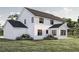 Rear exterior of a modern farmhouse with white siding and black trim at 3629 Centerville Rosebud Rd, Snellville, GA 30039