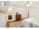 Bright bedroom with hardwood floors, a ceiling fan, and closet space at 4020 N Cooper Lake Se Rd, Smyrna, GA 30082