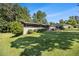 Well-maintained exterior with a lush green lawn and mature trees providing shade at 4020 N Cooper Lake Se Rd, Smyrna, GA 30082