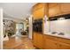 Functional kitchen with wood cabinetry and views into an adjacent living space at 4020 N Cooper Lake Se Rd, Smyrna, GA 30082
