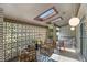 Cozy covered patio with skylights, comfortable seating, and unique brick accents at 4020 N Cooper Lake Se Rd, Smyrna, GA 30082