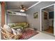 Cozy sunroom features comfortable seating, neutral paint, ample natural light, and a decorative rug at 4020 N Cooper Lake Se Rd, Smyrna, GA 30082