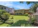 A lush backyard with an open lawn, mature landscaping and a table to enjoy your outdoor space at 437 Eastland Dr, Decatur, GA 30030