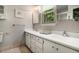 Bathroom features a double vanity with white cabinets and a window for natural light at 437 Eastland Dr, Decatur, GA 30030