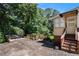Spacious driveway leading to a charming home, surrounded by lush greenery and mature trees at 437 Eastland Dr, Decatur, GA 30030