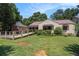 Attractive home with a green lawn and wooden ramp that provides accessibility to the front door at 437 Eastland Dr, Decatur, GA 30030