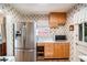 Bright kitchen features stainless steel appliances, ample counter space, and classic wallpaper at 437 Eastland Dr, Decatur, GA 30030