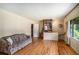 Inviting living room with hardwood floors, a comfortable sofa, and plenty of natural light at 437 Eastland Dr, Decatur, GA 30030