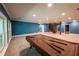 Spacious basement featuring a pool table, blue walls, and easy access to stairs leading upstairs at 5780 Punkintown Rd, Douglasville, GA 30135
