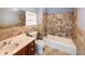 Traditional bathroom with a combined tub and shower, vanity, and neutral-toned tiles at 5780 Punkintown Rd, Douglasville, GA 30135