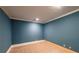 This bedroom features a neutral carpet and blue painted walls at 5780 Punkintown Rd, Douglasville, GA 30135
