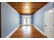 Spacious bonus room offers hardwood floors, a wooden ceiling, and doors to the backyard at 5780 Punkintown Rd, Douglasville, GA 30135