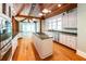 Well-lit eat-in kitchen offers wood ceiling, stainless appliances, and granite countertops at 5780 Punkintown Rd, Douglasville, GA 30135