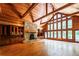 Living room boasts wood ceiling, fireplace, built-ins, hardwood floors and abundant natural light at 5780 Punkintown Rd, Douglasville, GA 30135