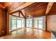 Sitting room featuring hardwood floors, ceiling fan, and large picture windows at 5780 Punkintown Rd, Douglasville, GA 30135