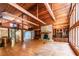 Spacious living room boasts wood ceiling, fireplace, hardwood floors, and custom built-ins at 5780 Punkintown Rd, Douglasville, GA 30135