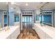 Large bathroom featuring double vanities, beautiful tile floor, and an open doorway to another room at 5780 Punkintown Rd, Douglasville, GA 30135