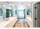 An expansive bathroom with dual vanities, tiled floors, and separate shower at 5780 Punkintown Rd, Douglasville, GA 30135