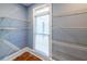 Spacious walk-in closet featuring built-in shelving and a window to allow in natural light at 5780 Punkintown Rd, Douglasville, GA 30135