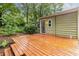 Backyard featuring a deck, exterior, and fire pit surrounded by lush greenery at 1424 Van Epps Se Ave, Atlanta, GA 30316
