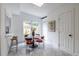 Sunlit breakfast nook with a round table and stylish red chairs at 1424 Van Epps Se Ave, Atlanta, GA 30316