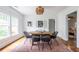 Bright dining room with hardwood floors, modern lighting, and a view to the main bedroom at 1424 Van Epps Se Ave, Atlanta, GA 30316