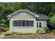 Charming single-Gathering home featuring a covered front porch, painted brick foundation, and lush landscaping at 1424 Van Epps Se Ave, Atlanta, GA 30316