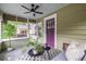 Cozy screened front porch featuring seating and decor at 1424 Van Epps Se Ave, Atlanta, GA 30316