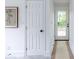 Hallway featuring doors and a decorative floral wall hanging at 1424 Van Epps Se Ave, Atlanta, GA 30316