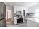 Well-lit kitchen with stainless steel range and appliances, white cabinets, and ample counter space at 1424 Van Epps Se Ave, Atlanta, GA 30316