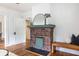Living room features a decorative brick fireplace and view to the dining room at 1424 Van Epps Se Ave, Atlanta, GA 30316
