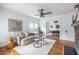 Bright living room with neutral decor, a fireplace, and view to the dining room at 1424 Van Epps Se Ave, Atlanta, GA 30316