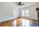 Bright living room featuring hardwood floors, white trim, and a ceiling fan at 1424 Van Epps Se Ave, Atlanta, GA 30316