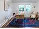 Bright office space featuring a wood desk, chair, hardwood floors, and a beautiful rug at 1424 Van Epps Se Ave, Atlanta, GA 30316