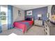 Comfortable bedroom featuring a cozy bed, stylish decor, and ample natural light from the window at 1678 Lacebark Elm Way Way, Lawrenceville, GA 30045