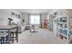Bonus room with white carpet, modern furniture, and decor for entertaining and relaxation at 1678 Lacebark Elm Way Way, Lawrenceville, GA 30045