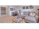 Bonus room with a chaise lounge, modern coffee table, games, and camera-themed artwork at 1678 Lacebark Elm Way Way, Lawrenceville, GA 30045