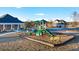 Community playground with slides and climbing equipment, set against homes at 1678 Lacebark Elm Way Way, Lawrenceville, GA 30045