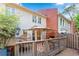 Backyard deck offers a relaxed sitting and dining area with mature trees at 403 Defoors Mill Nw Dr, Atlanta, GA 30318