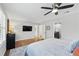 Spacious bedroom with a ceiling fan, tv, and an ensuite bathroom at 403 Defoors Mill Nw Dr, Atlanta, GA 30318